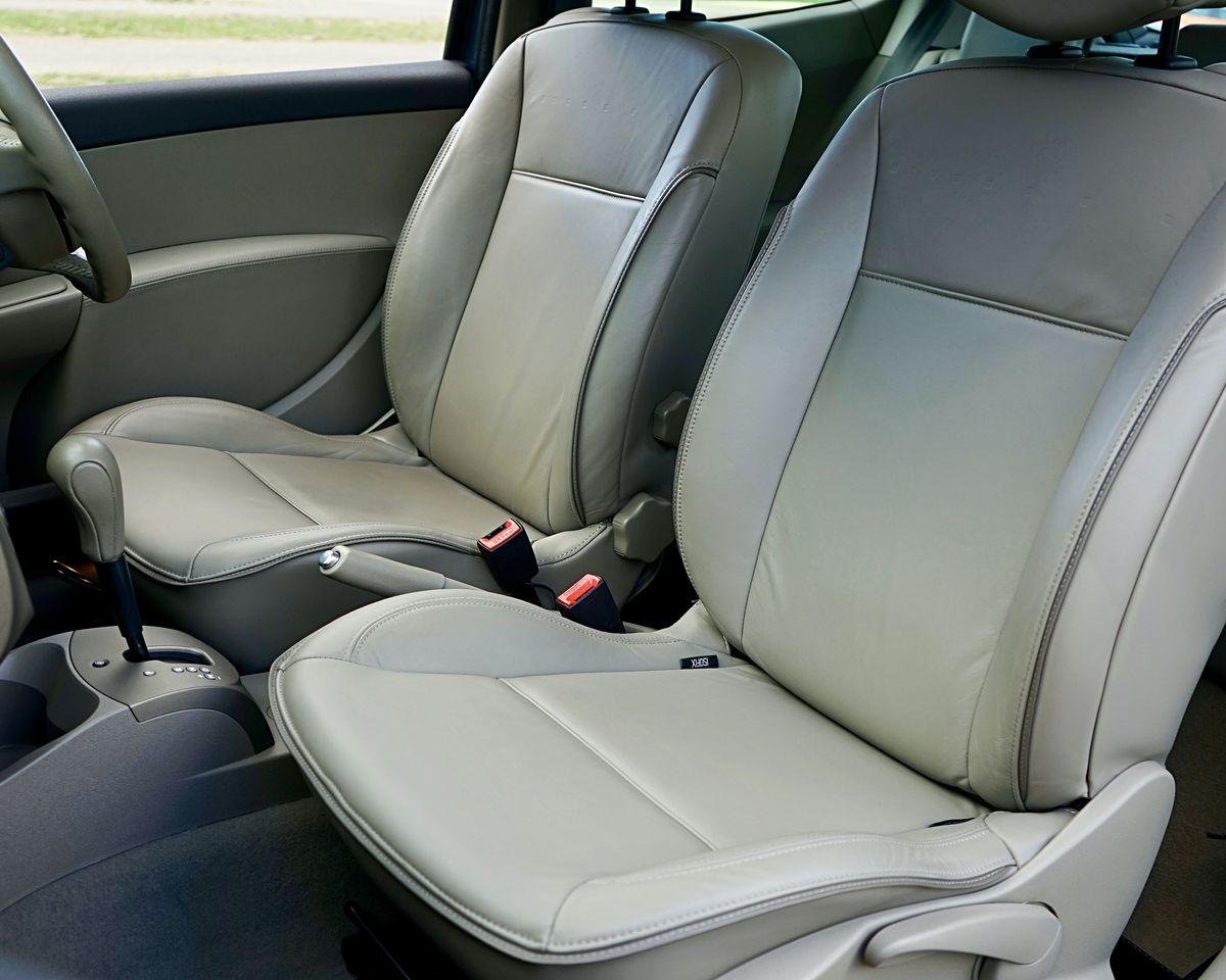 Car interior with leather seats and steering wheel, illustrating car seat reupholstery in Auckland