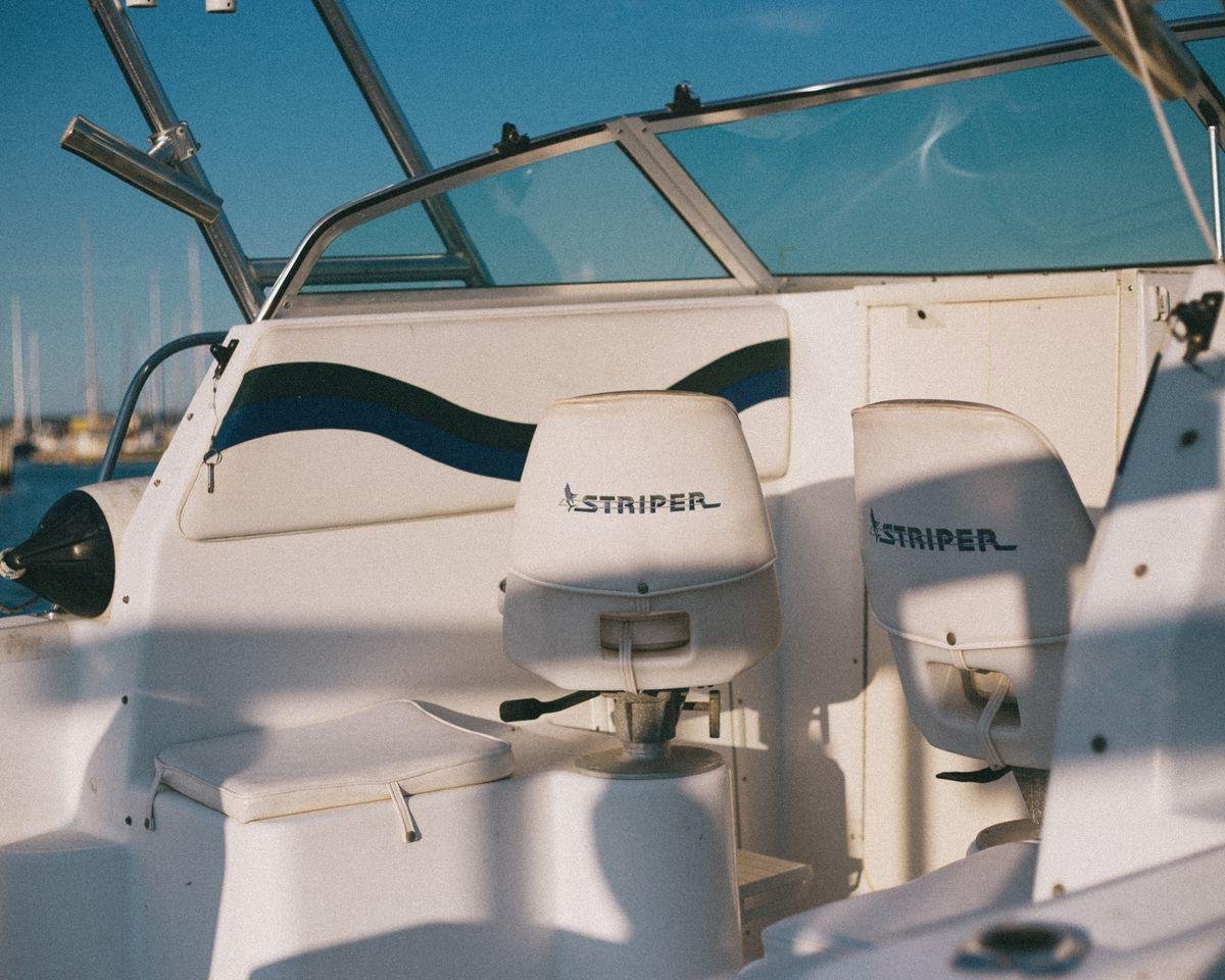 Motorboat interior with cushioned marine upholstery and ocean view