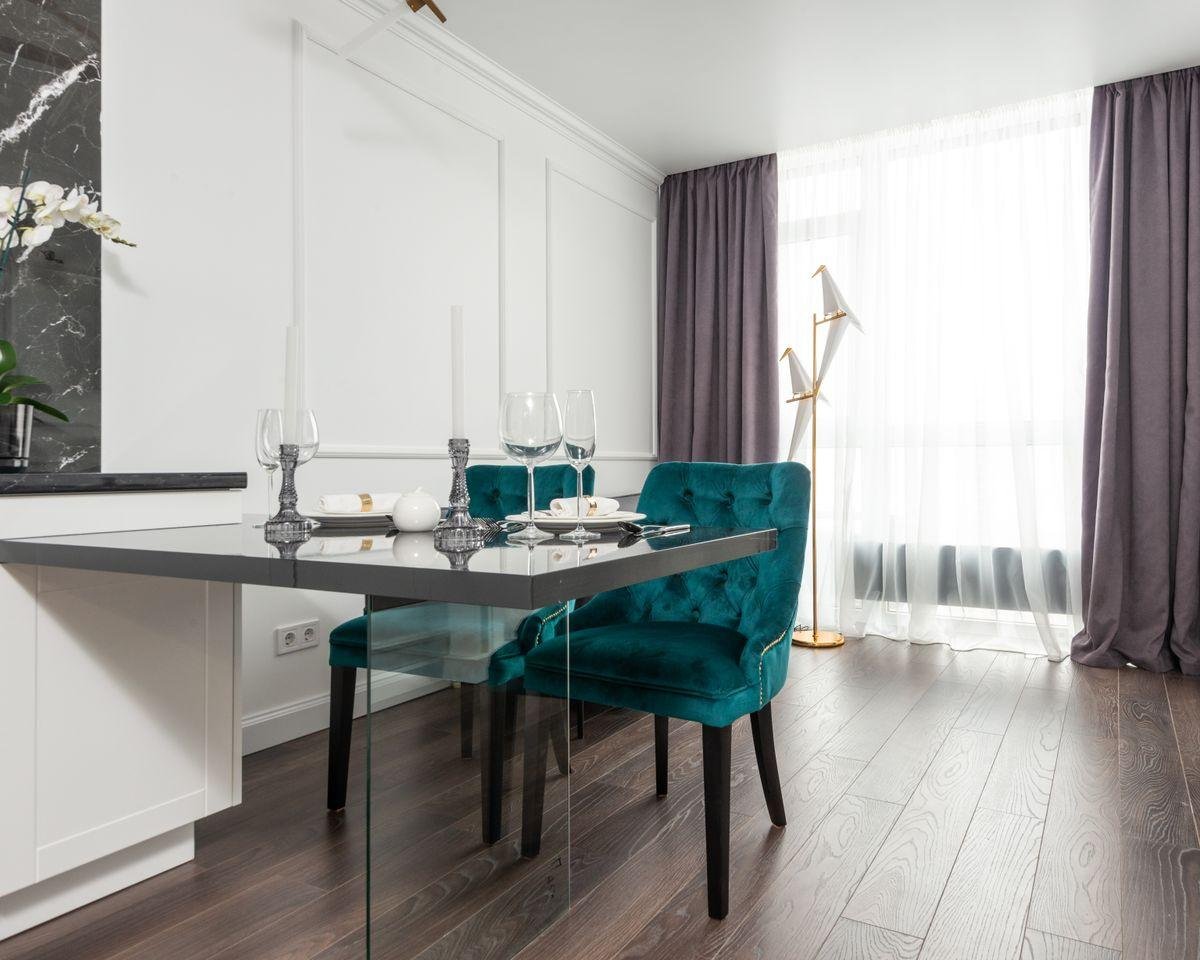 Upholstered dining chairs around a set table, illustrating dining chair reupholstery in New Zealand