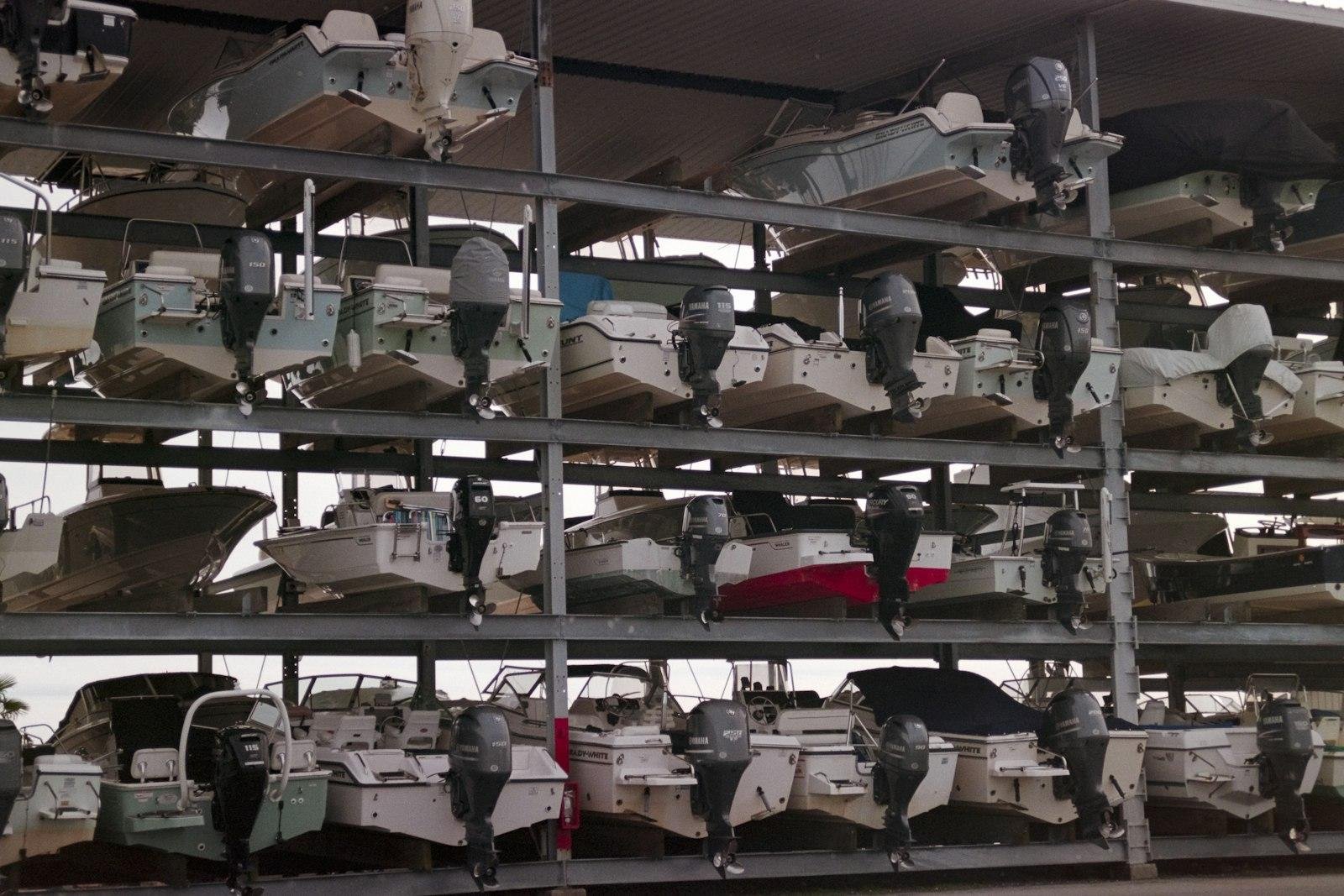 Trailer boats and runabouts stored on multi-level dry stack racks under cover